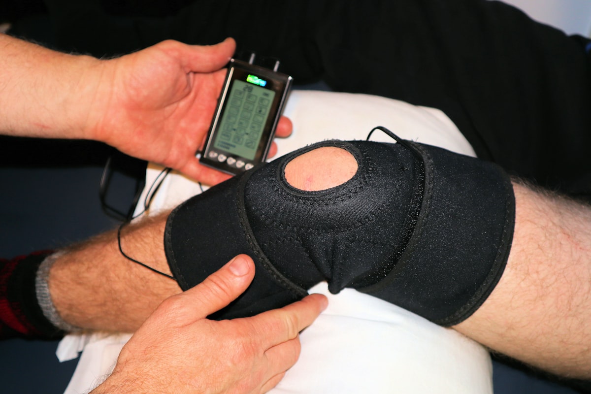 Therapist guiding a knee strengthening exercise